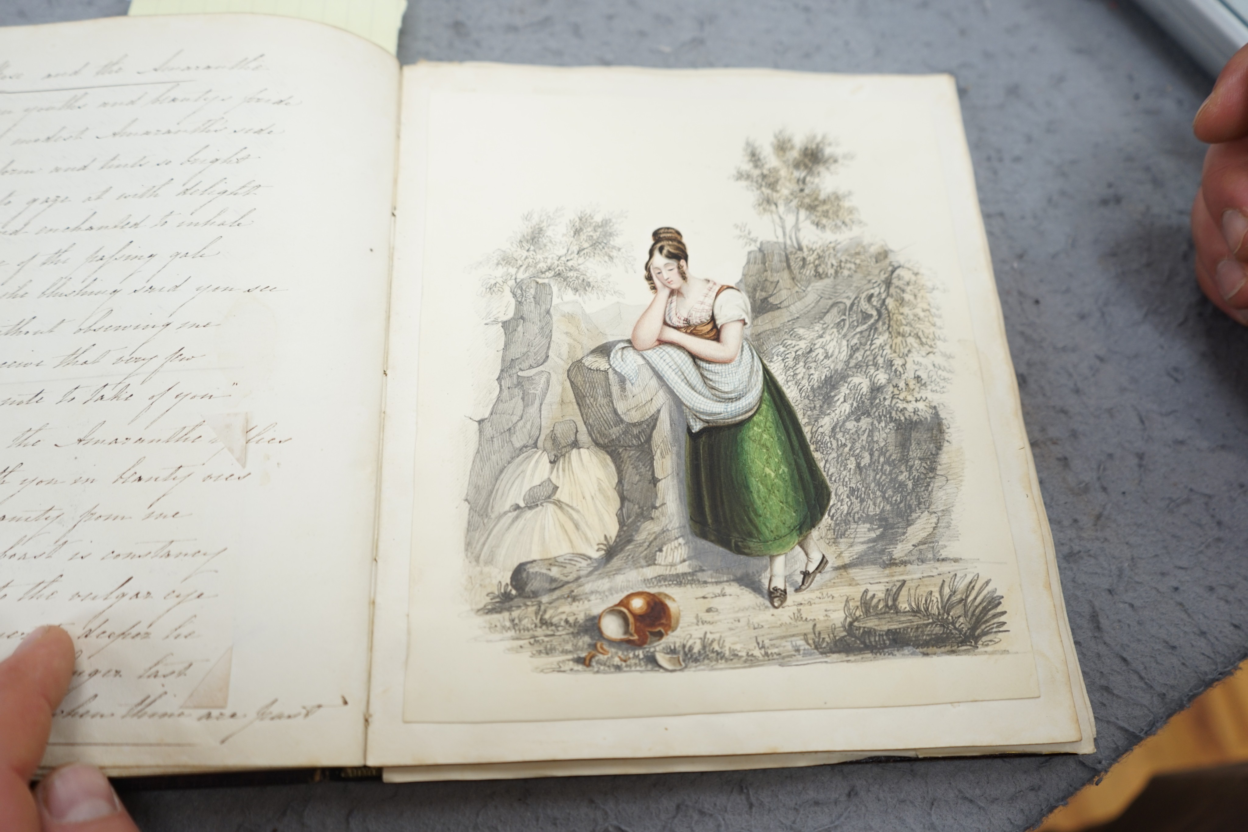 An early 19th century hand written journal, sketch book with scraps, coloured engravings, etc.